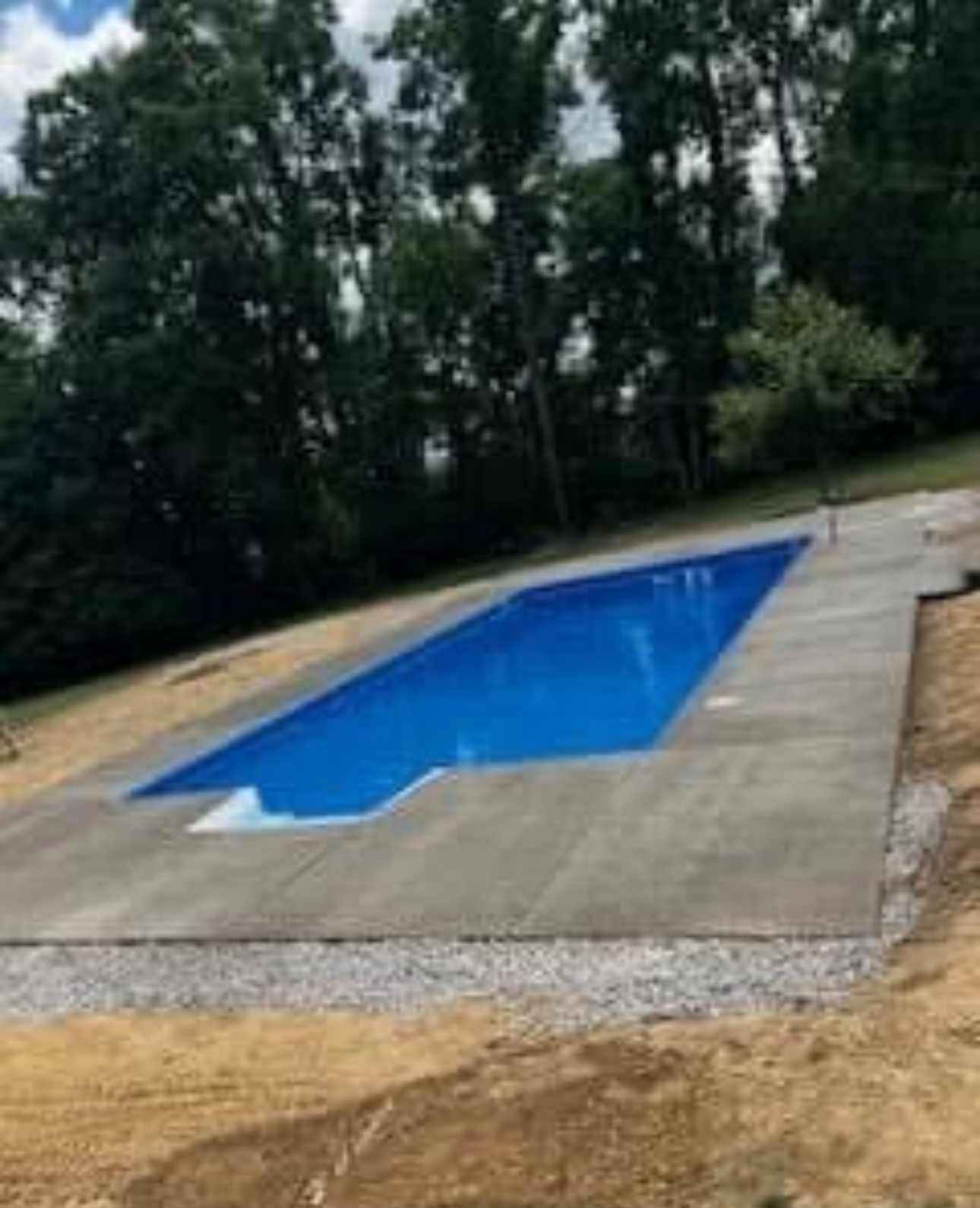 Concrete deck surrounding an in-ground swimming pool